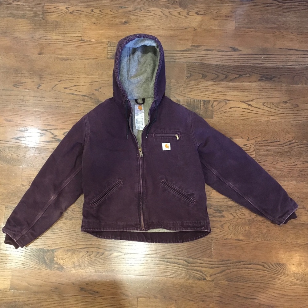 Sherpa lined Carhartt jacket with hood. Women’s size M deep wine color.